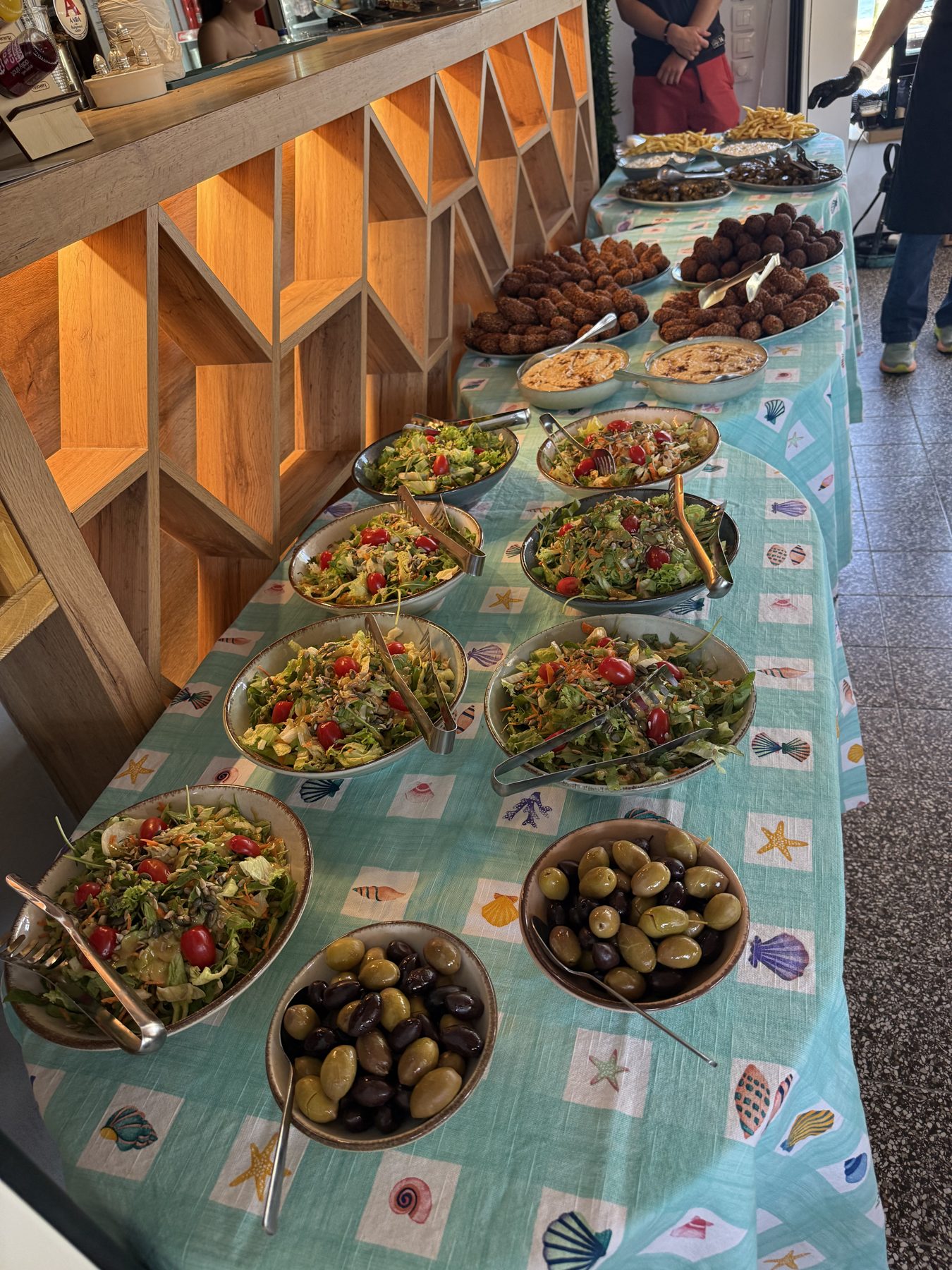 Greek food spread across a shared table